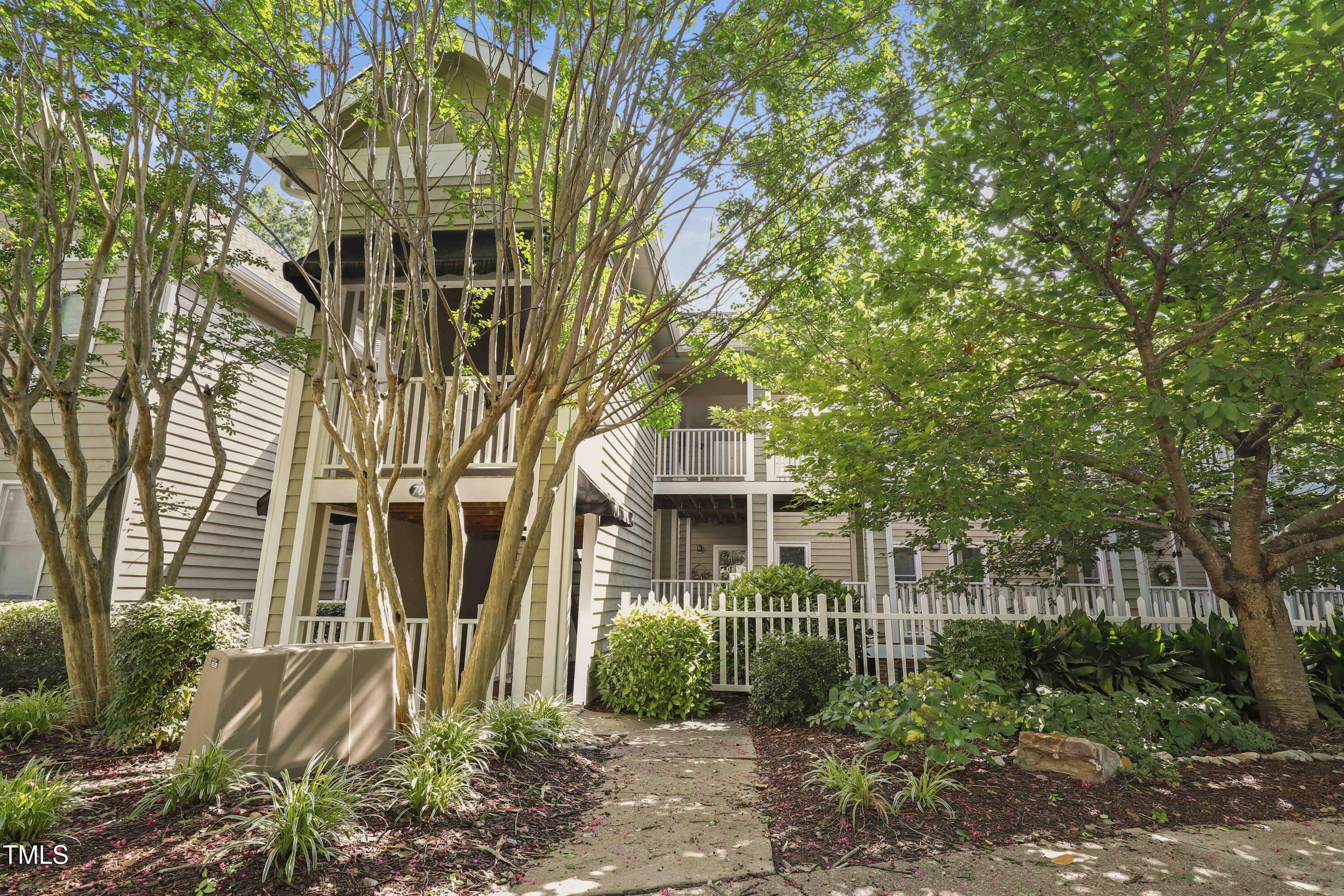 720 Springfork Drive Cary, NC 27513 - Photo 2 of 34 a front view of a house with a yard