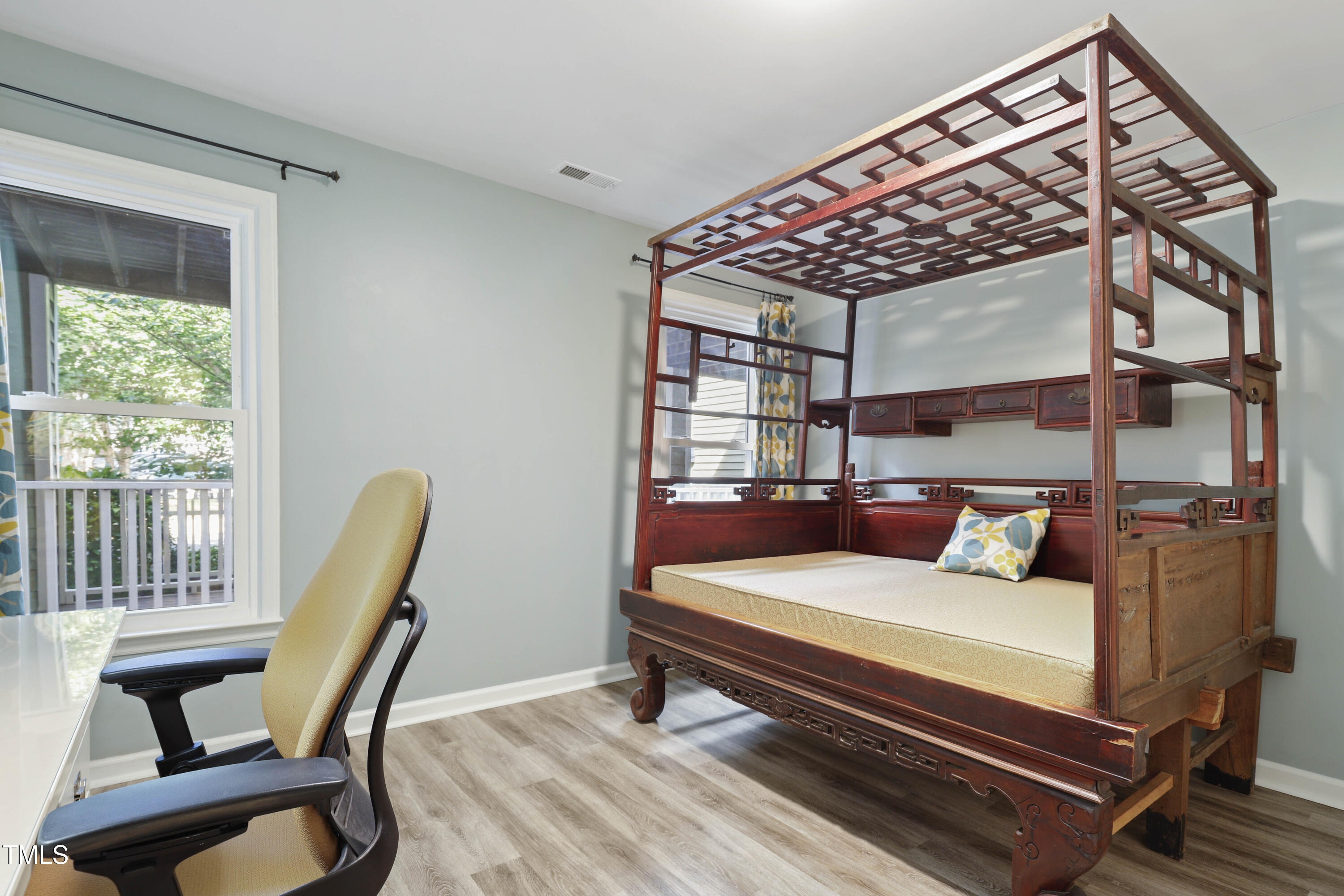 720 Springfork Drive Cary, NC 27513 - Photo 21 of 34 a bedroom with furniture and a window