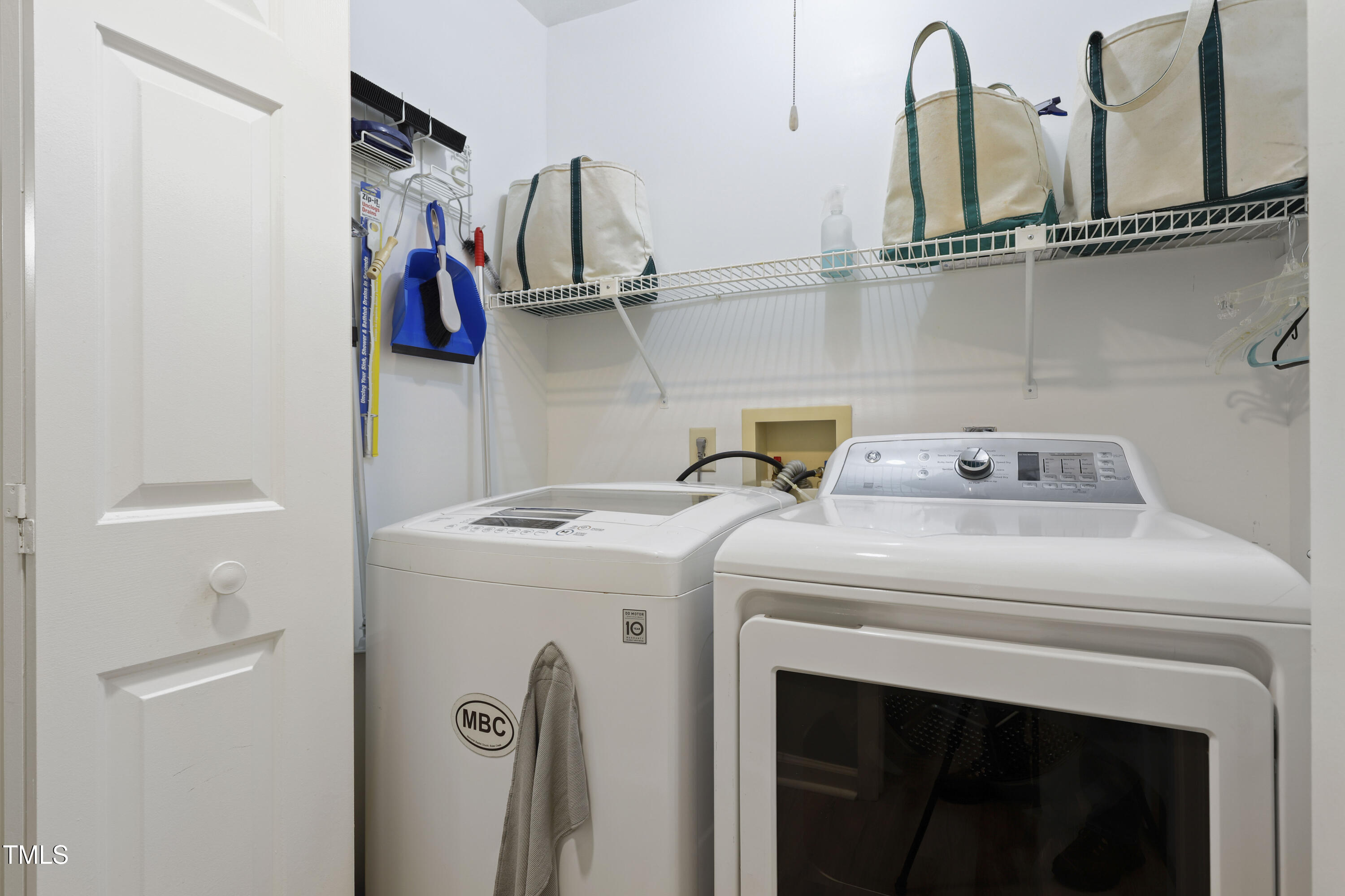 720 Springfork Drive Cary, NC 27513 - Photo 25 of 34 a utility room with dryer and washer