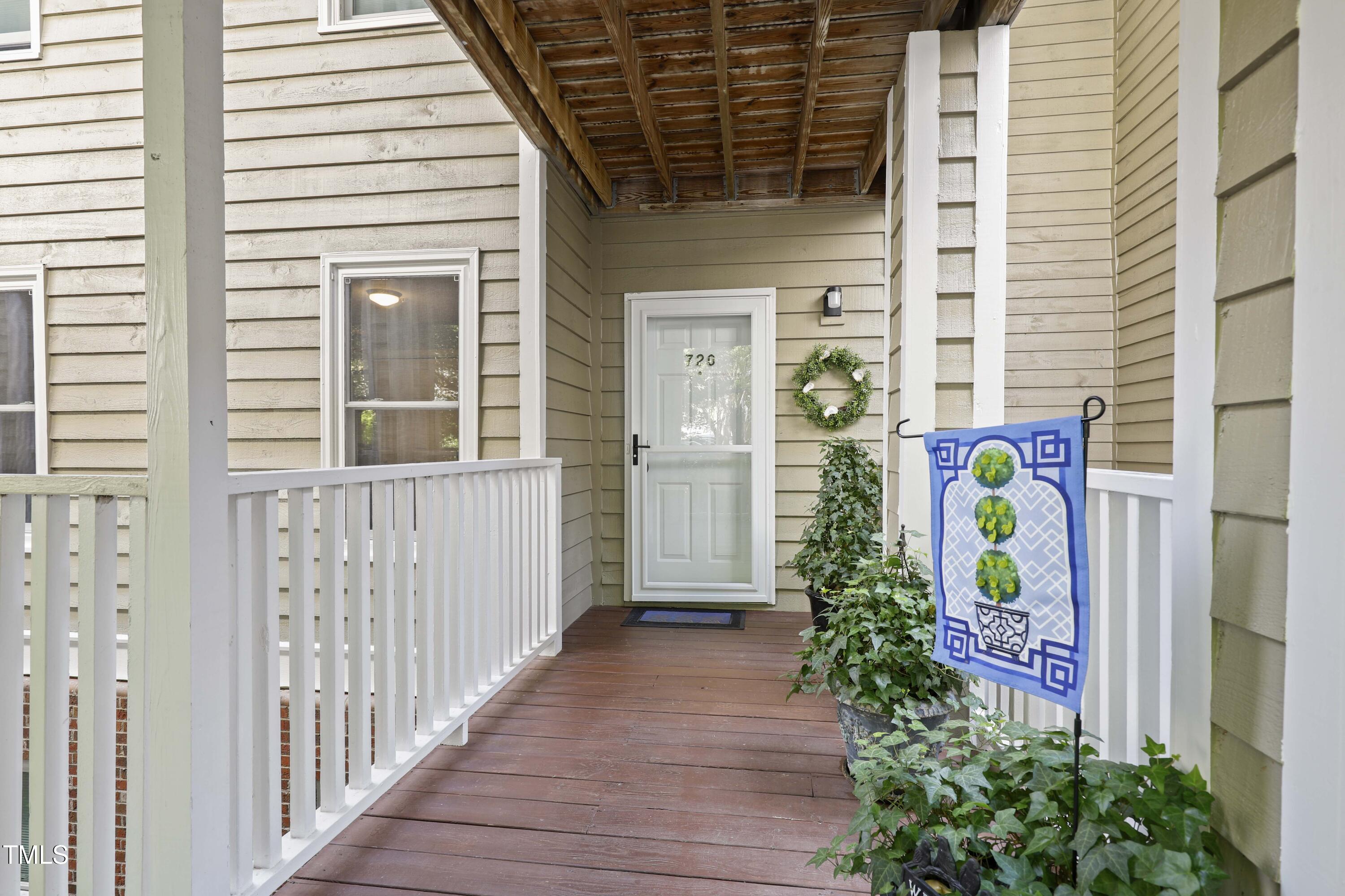 720 Springfork Drive Cary, NC 27513 - Photo 3 of 34 a view of a door of the house with potted plants