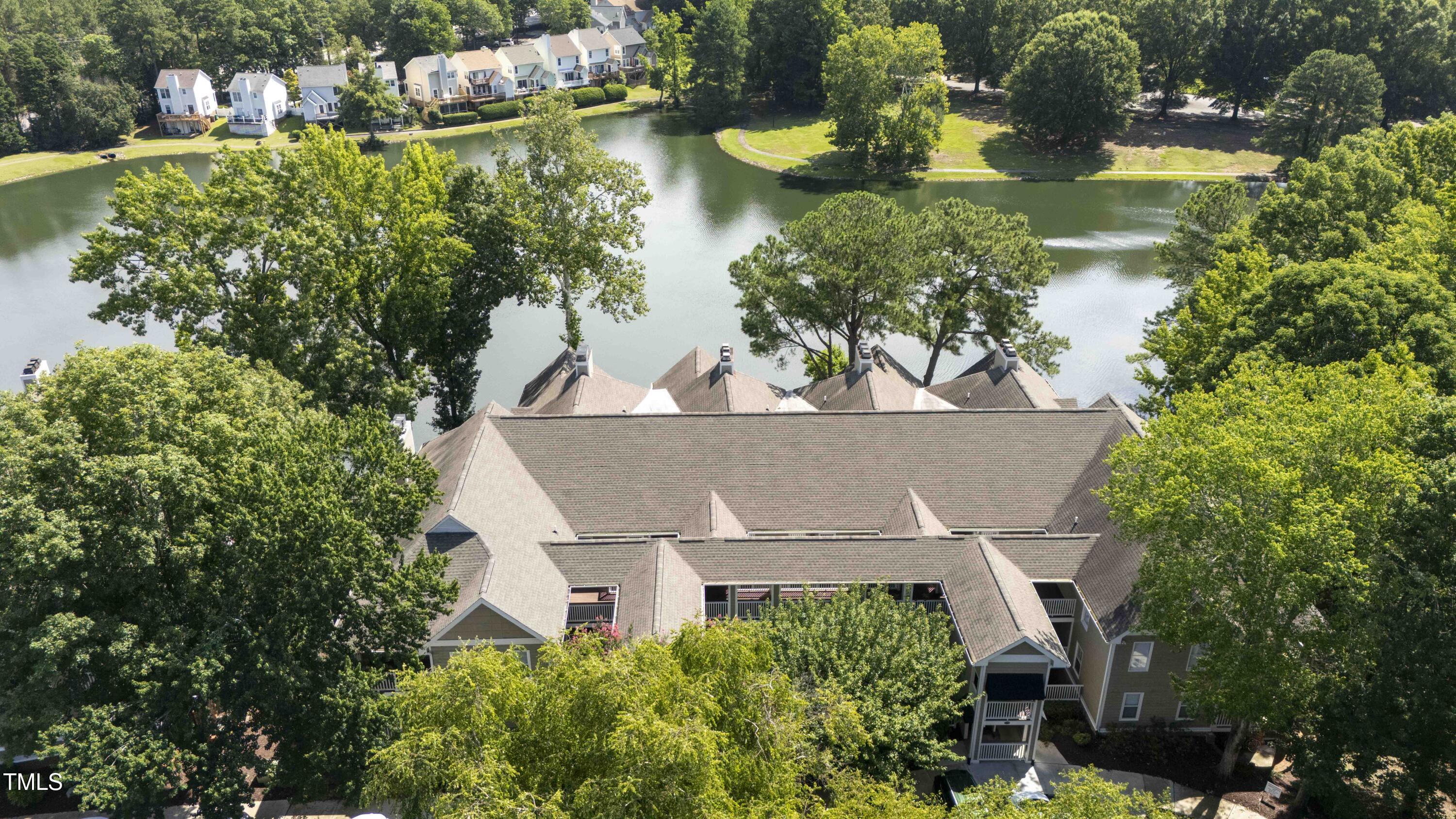 720 Springfork Drive Cary, NC 27513 - Photo 32 of 34 an aerial view of a house with a garden and lake view