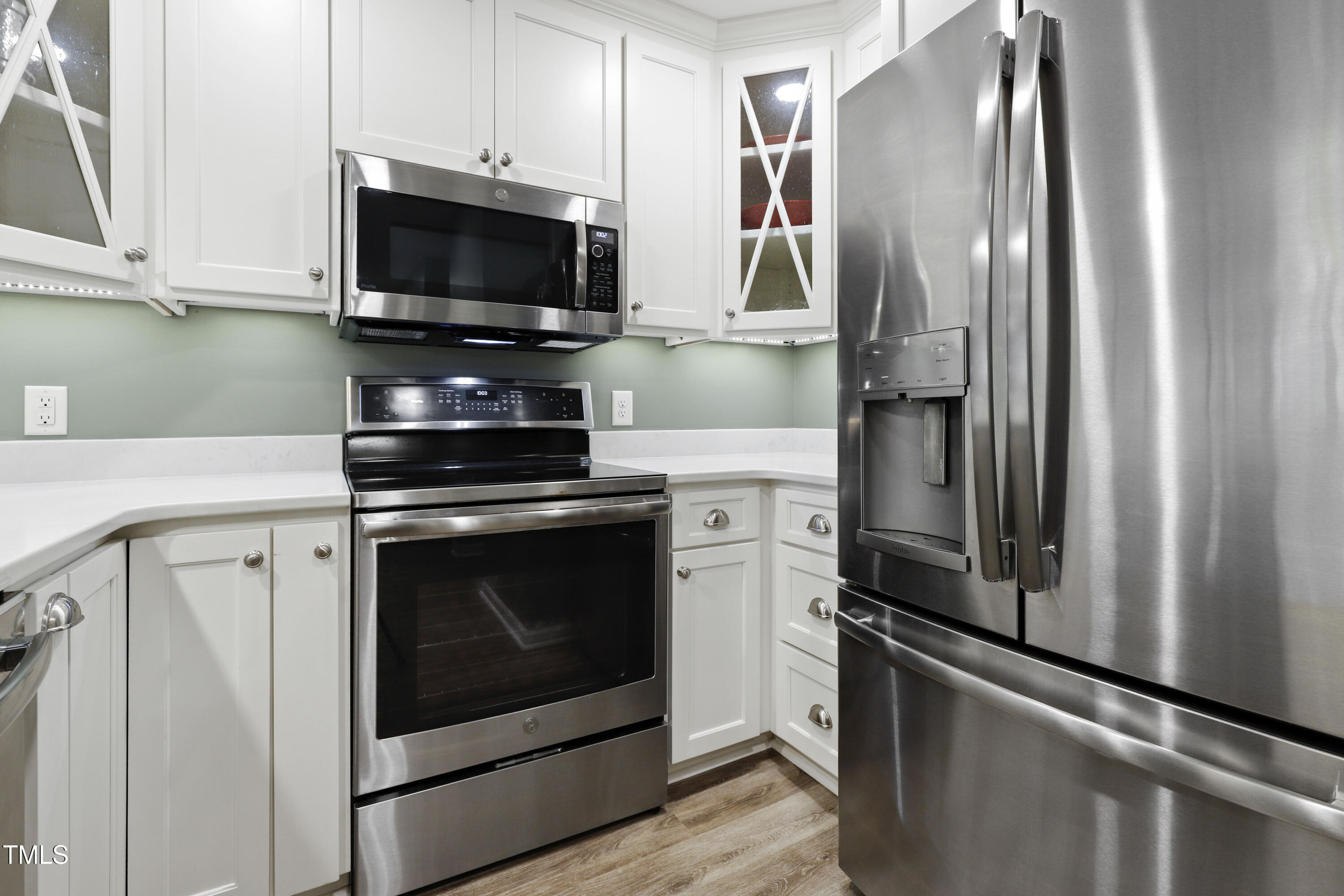 720 Springfork Drive Cary, NC 27513 - Photo 6 of 34 a kitchen with stainless steel appliances a refrigerator stove and microwave