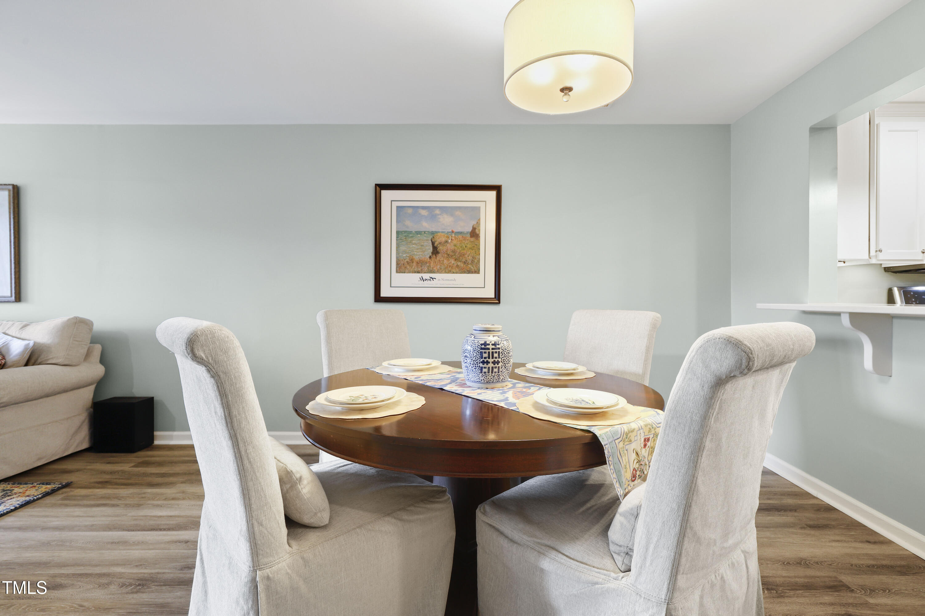 720 Springfork Drive Cary, NC 27513 - Photo 8 of 34 a view of a dining room with furniture and wooden floor