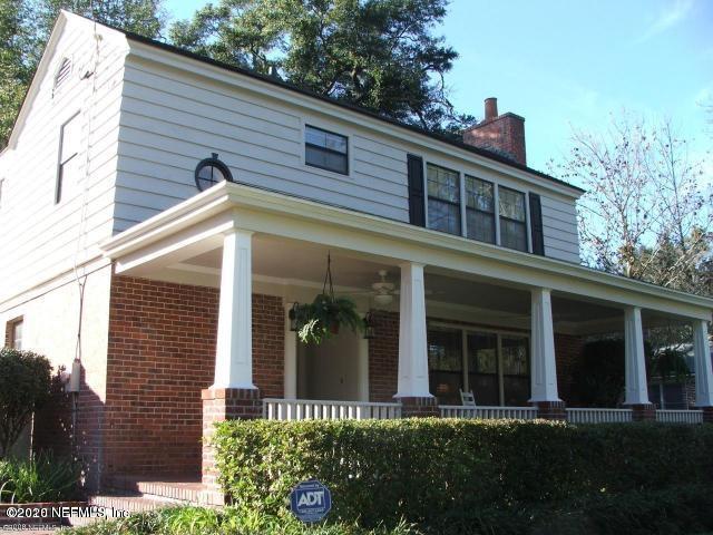 1318 Nicholson Road Jacksonville, FL 32207 - Photo 1 of 19 a front view of a house with a yard