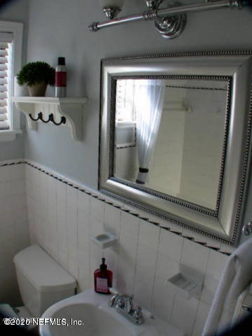 1318 Nicholson Road Jacksonville, FL 32207 - Photo 14 of 19 a bathroom with a toilet and a shower