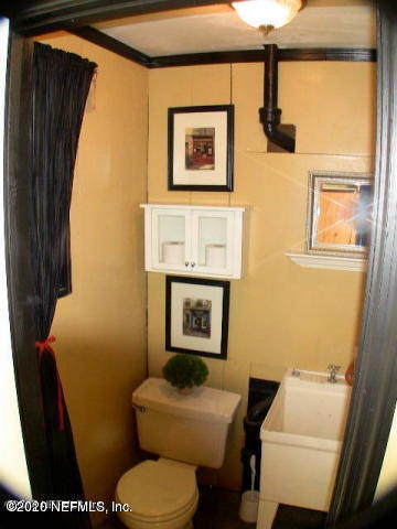 1318 Nicholson Road Jacksonville, FL 32207 - Photo 19 of 19 a bathroom with a toilet and a sink