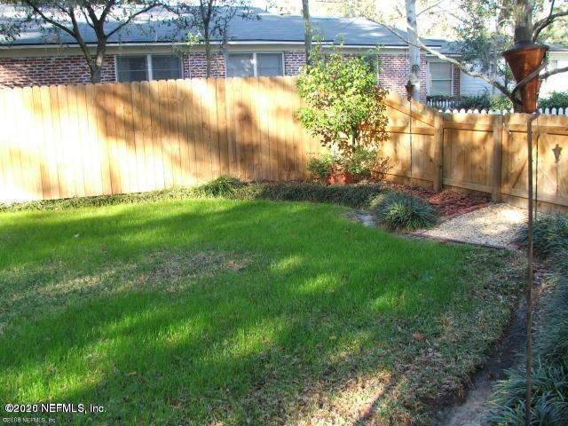 1318 Nicholson Road Jacksonville, FL 32207 - Photo 5 of 19 a view of backyard with fountain and large trees