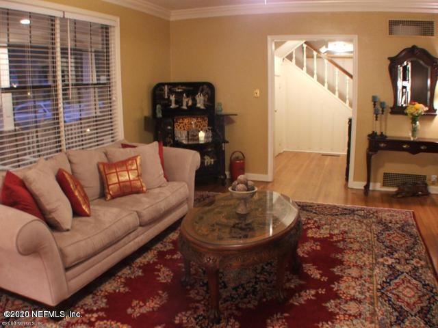 1318 Nicholson Road Jacksonville, FL 32207 - Photo 6 of 19 a living room with furniture and a fireplace