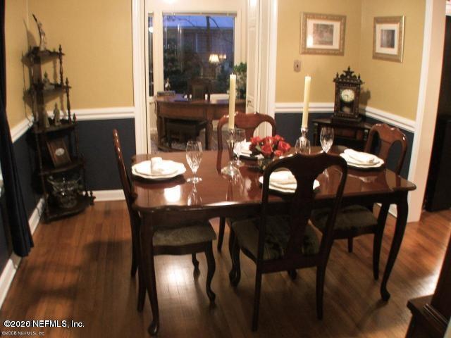 1318 Nicholson Road Jacksonville, FL 32207 - Photo 8 of 19 a view of a dining room with furniture and wooden floor