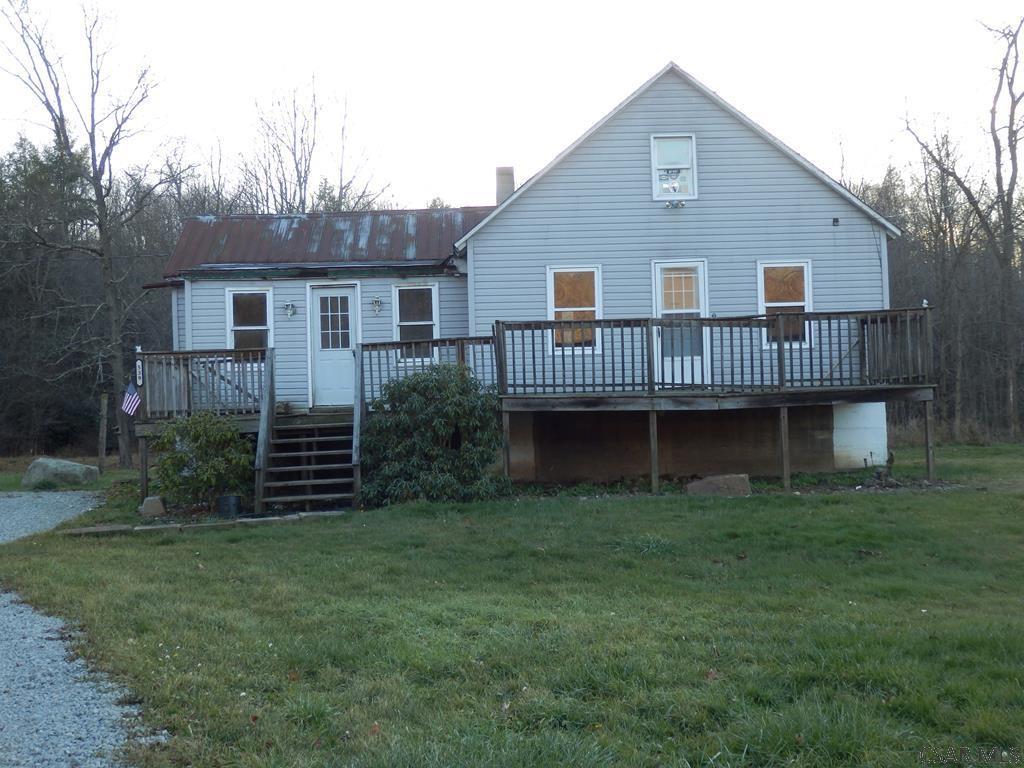 539 Piney Run Road Salisbury, PA 15558 - Photo 1 of 4 a view of a house with a yard and a wooden deck