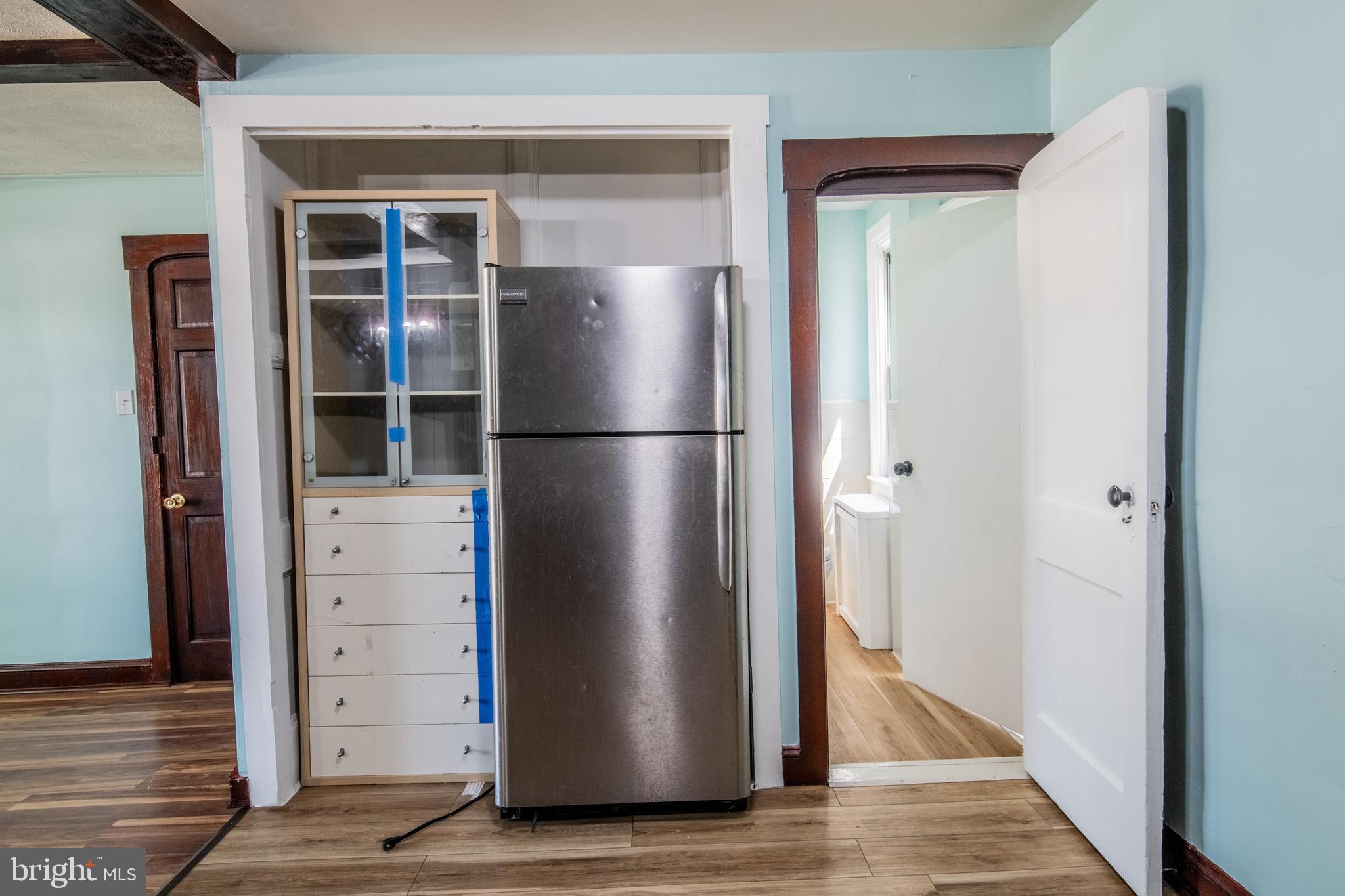 309 Hampden Road Upper Darby, PA 19082 - Photo 16 of 19 a view of kitchen with wooden floor and refrigerator