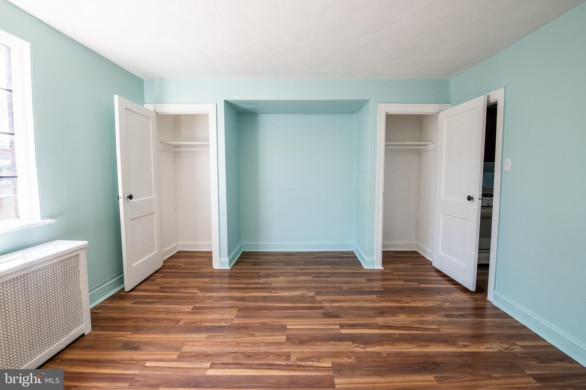 309 Hampden Road Upper Darby, PA 19082 - Photo 17 of 19 a big room with wooden floor and bathroom view