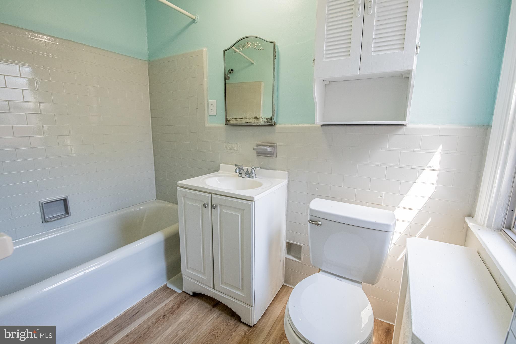 309 Hampden Road Upper Darby, PA 19082 - Photo 19 of 19 a bathroom with a toilet sink and mirror