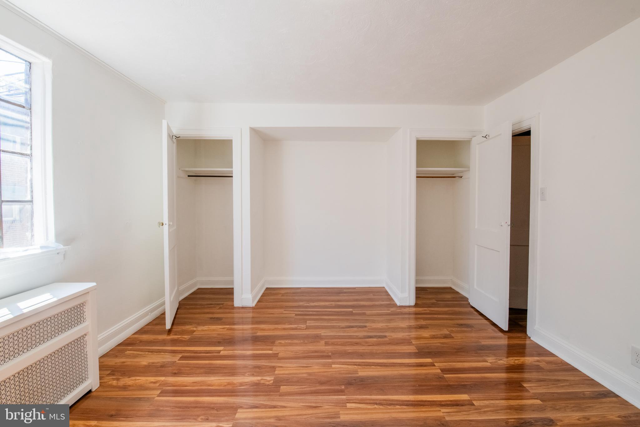 309 Hampden Road Upper Darby, PA 19082 - Photo 7 of 19 a view of a room with wooden floor and white walls