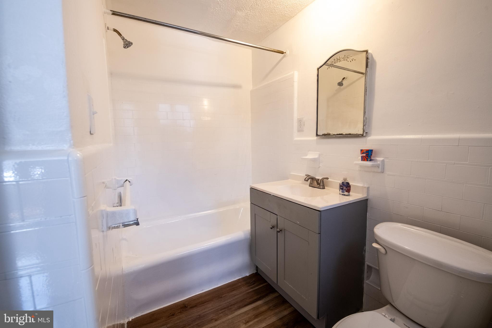 309 Hampden Road Upper Darby, PA 19082 - Photo 8 of 19 a bathroom with a sink a toilet and shower