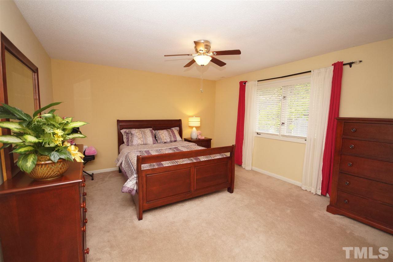 4100 Landfall Court Raleigh, NC 27613 - Photo 13 of 20 a room with furniture and a potted plant