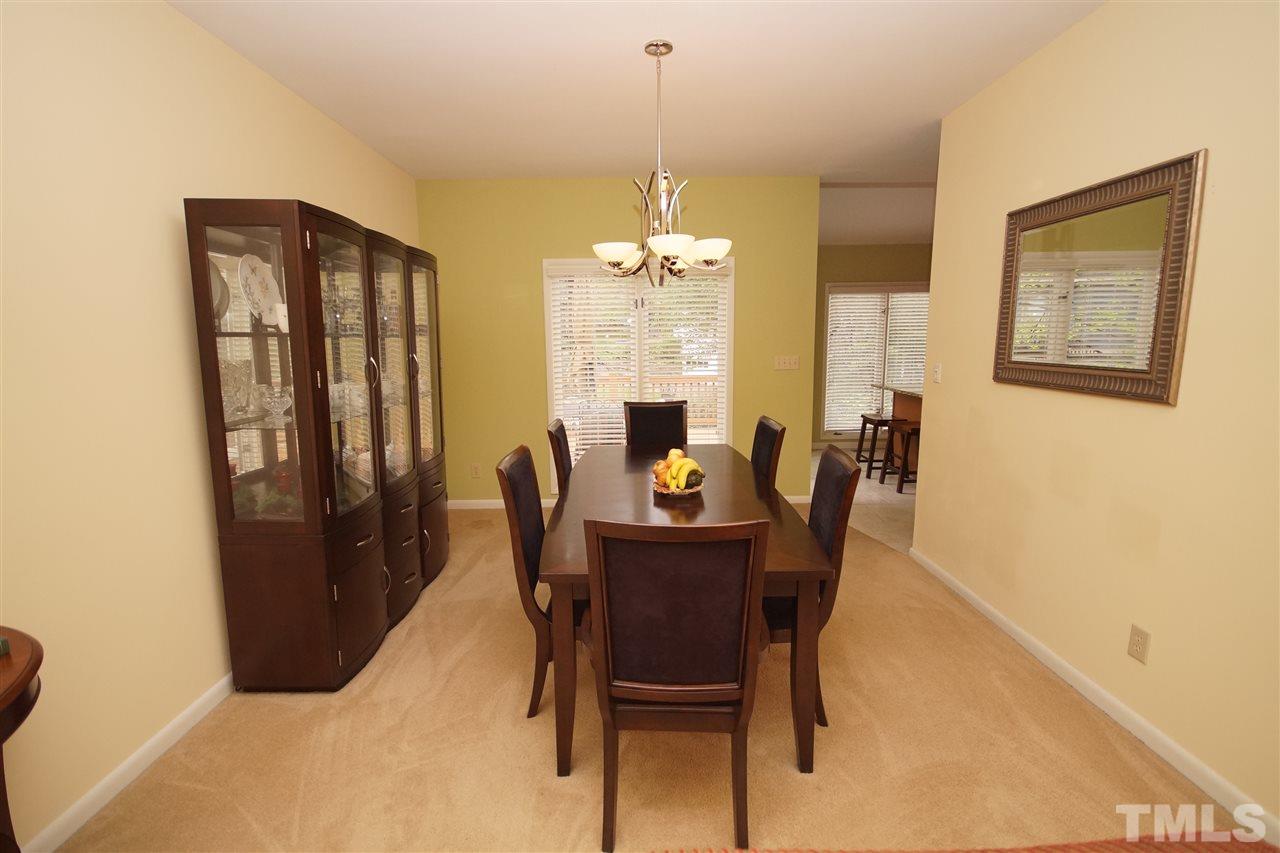 4100 Landfall Court Raleigh, NC 27613 - Photo 3 of 20 a dining room with furniture window and outside view