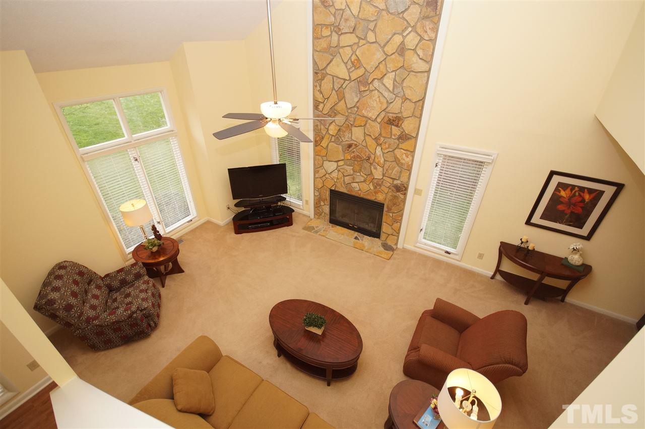 4100 Landfall Court Raleigh, NC 27613 - Photo 6 of 20 a bedroom with furniture and a fireplace