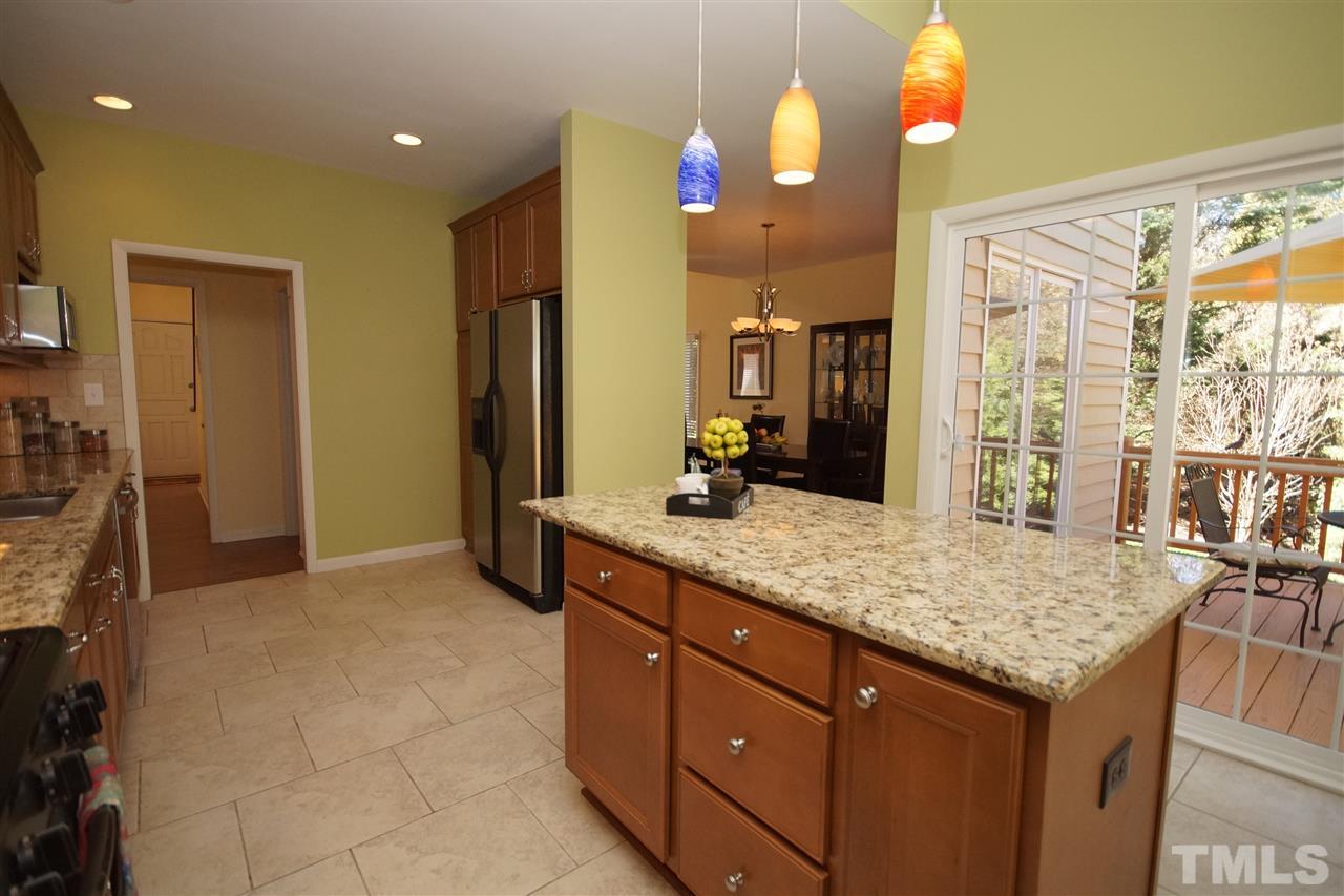 4100 Landfall Court Raleigh, NC 27613 - Photo 9 of 20 a bathroom with a granite countertop sink and a mirror