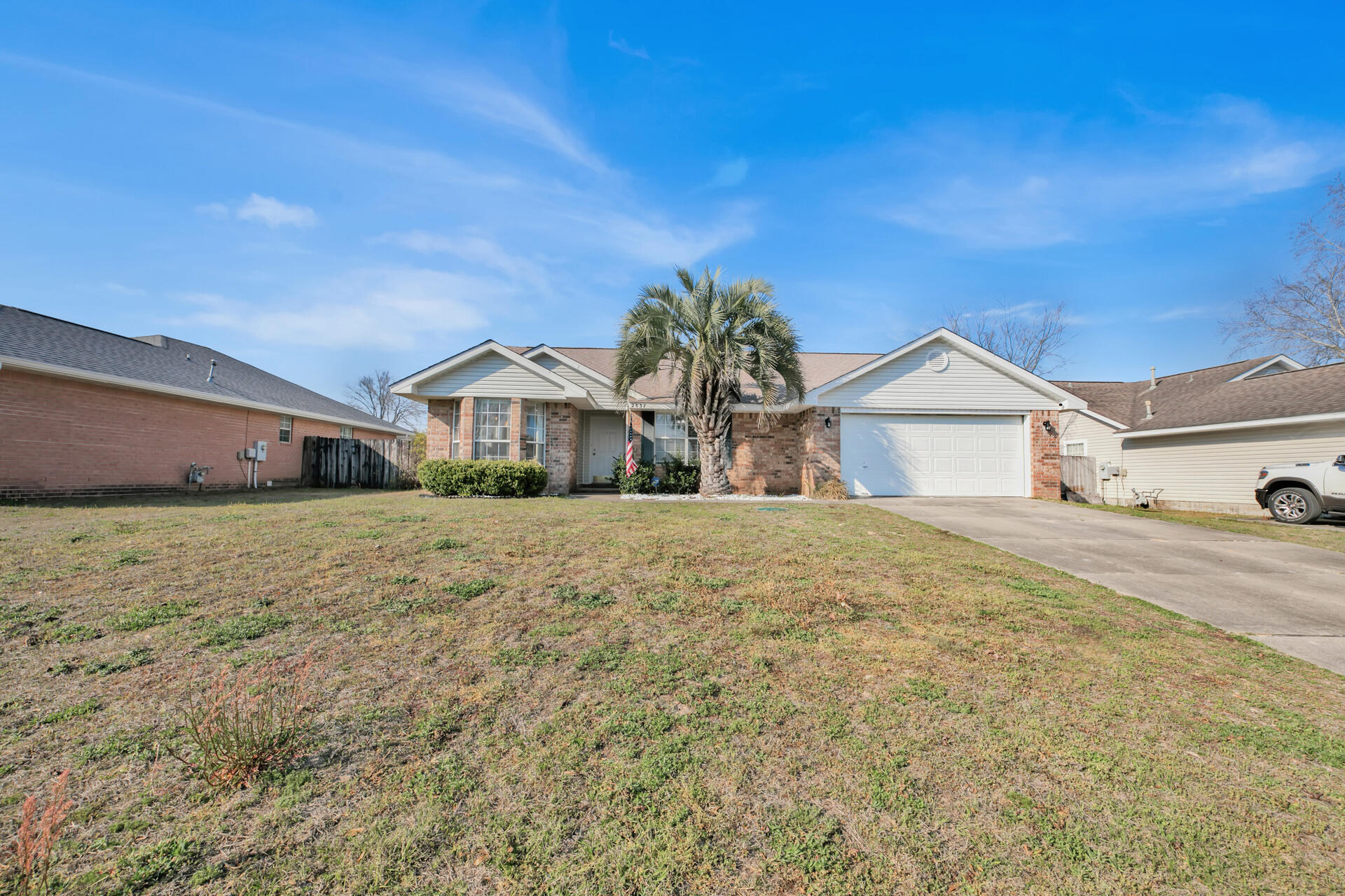 2837 Atoka Trail Crestview, FL 32539 - Photo 1 of 28 a front view of a house with a yard