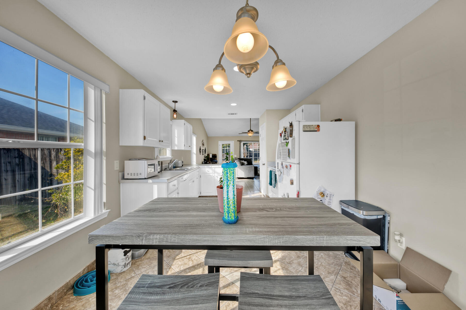 2837 Atoka Trail Crestview, FL 32539 - Photo 13 of 28 a kitchen with a table chairs and window