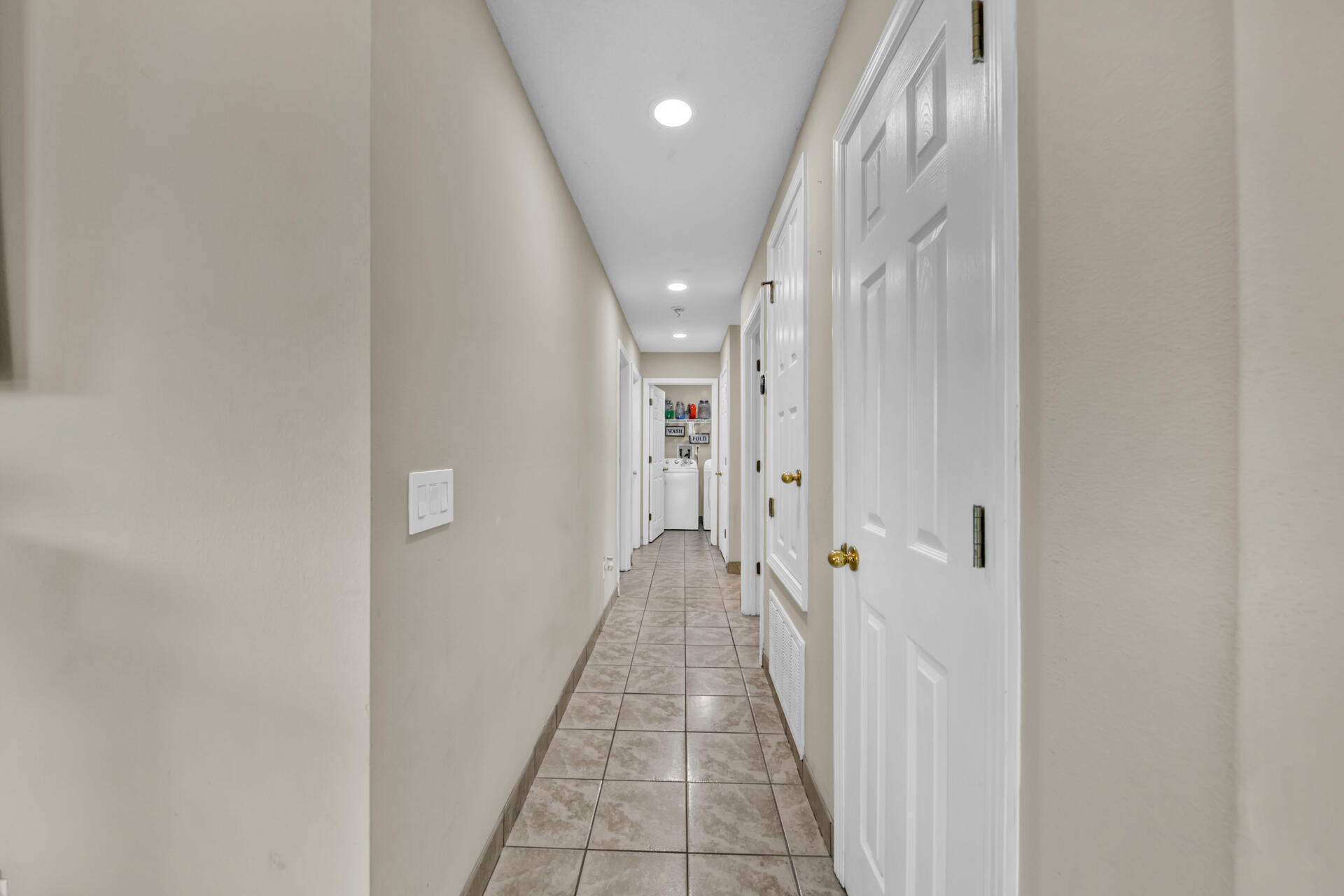 2837 Atoka Trail Crestview, FL 32539 - Photo 15 of 28 a view of a hallway with wooden floor