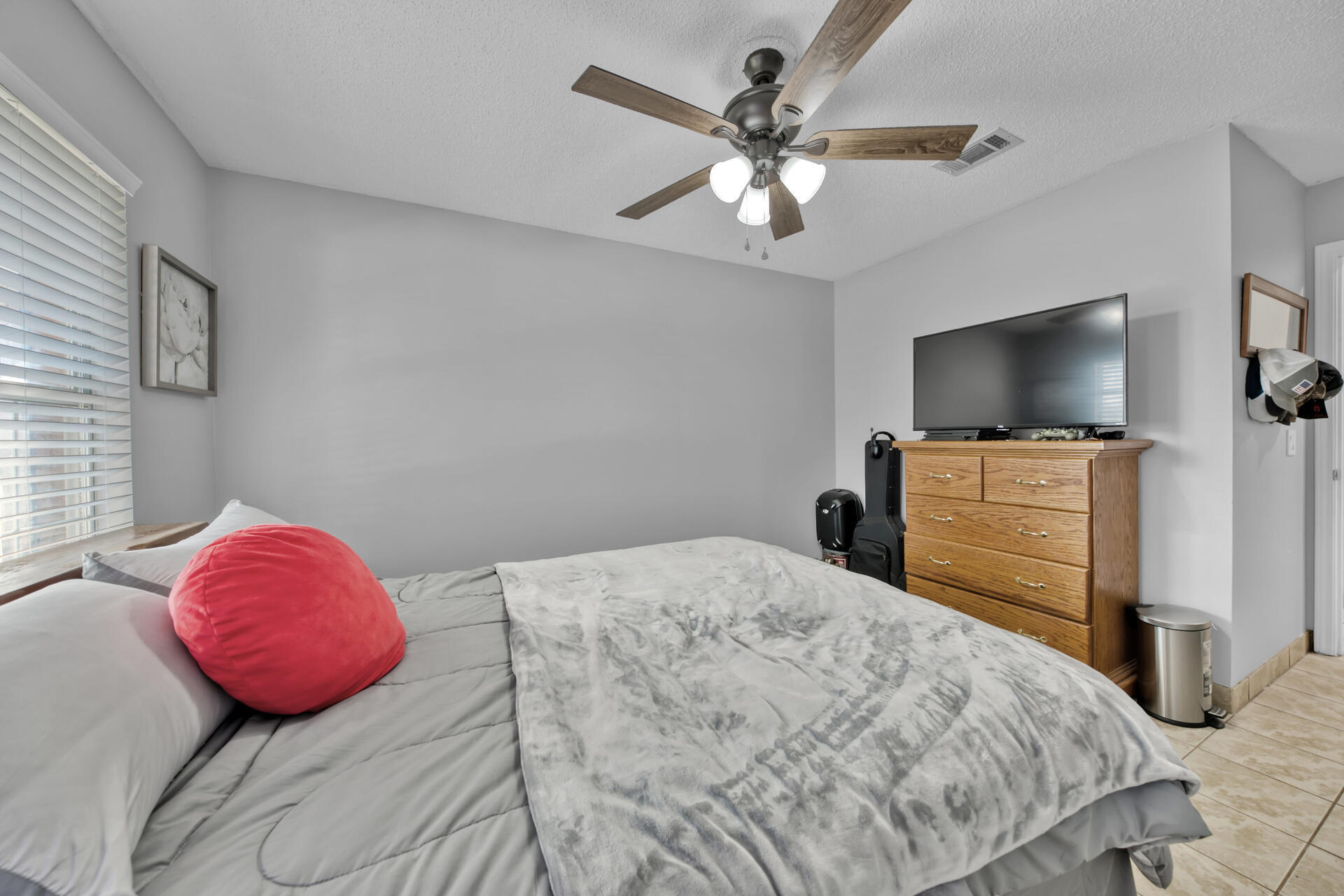 2837 Atoka Trail Crestview, FL 32539 - Photo 17 of 28 a bedroom with a bed and a flat screen tv