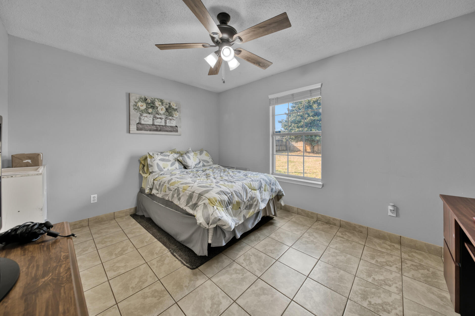2837 Atoka Trail Crestview, FL 32539 - Photo 19 of 28 a bedroom with a bed and a ceiling fan