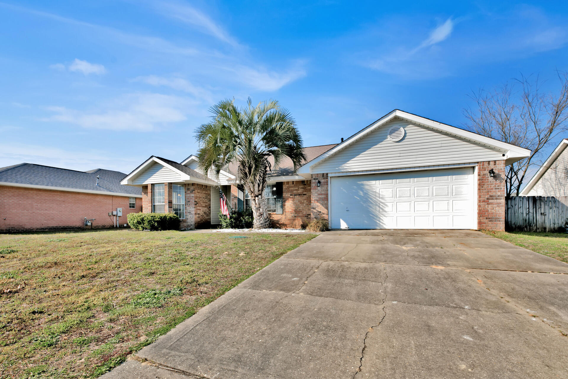 2837 Atoka Trail Crestview, FL 32539 - Photo 2 of 28 a front view of a house with a yard and garage