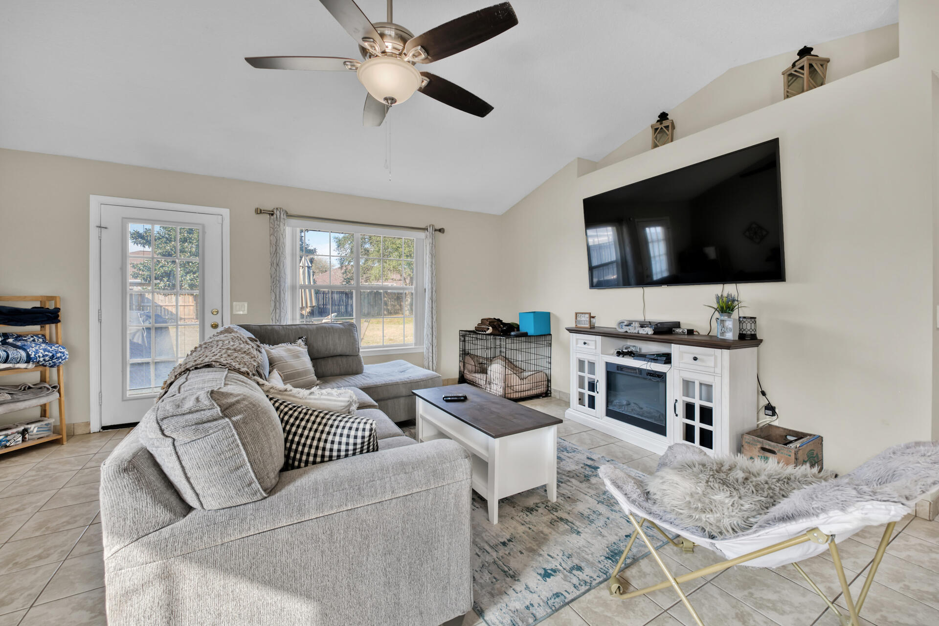 2837 Atoka Trail Crestview, FL 32539 - Photo 7 of 28 a living room with furniture a flat screen tv and a window
