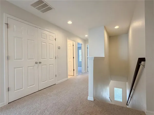 a view of a hallway with entryway