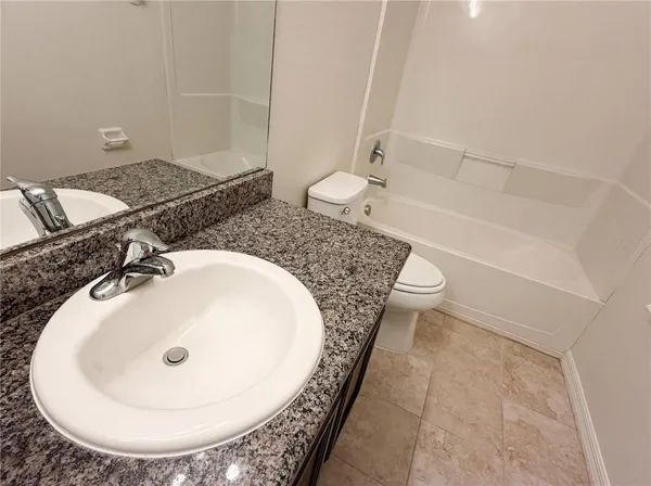 a bathroom with a sink and mirror