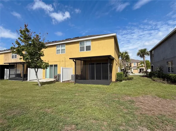 a view of a house with a yard