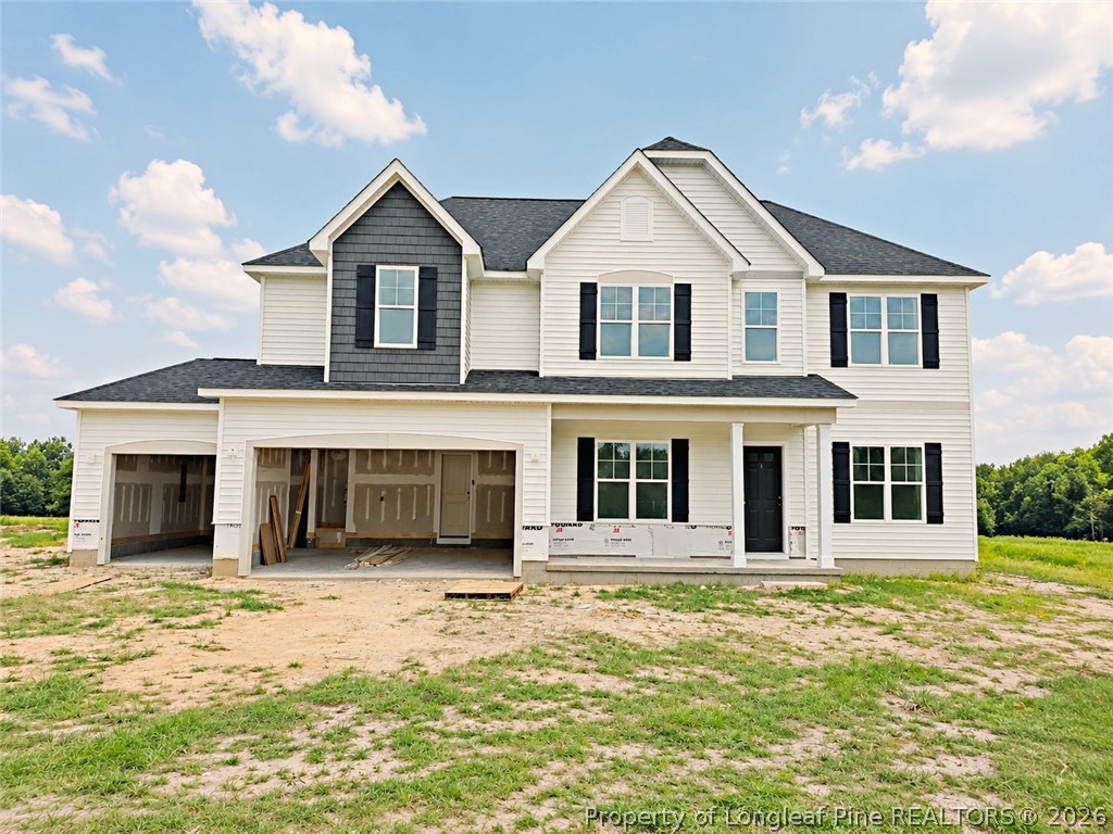 2650 Norrington Road Lillington, NC 27546 - Photo 1 of 24 a front view of a house with a yard
