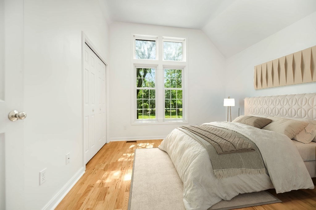 128 Audubon Drive, Unit 128 Acton, MA 01720 - Photo 20 of 42 a bedroom with a bed and a window