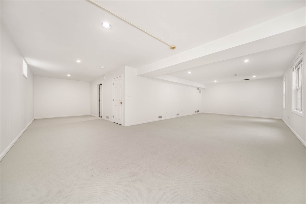 128 Audubon Drive, Unit 128 Acton, MA 01720 - Photo 24 of 42 an empty room with a empty space & window ceiling fan and windows