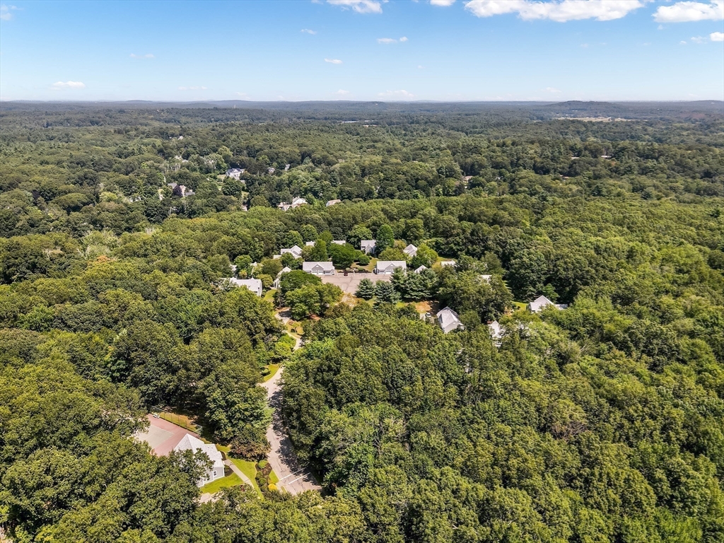 128 Audubon Drive, Unit 128 Acton, MA 01720 - Photo 33 of 42 an aerial view of residential houses with outdoor space and trees