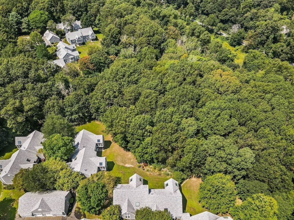 128 Audubon Drive, Unit 128 Acton, MA 01720 - Photo 36 of 42 an aerial view of a house with a yard