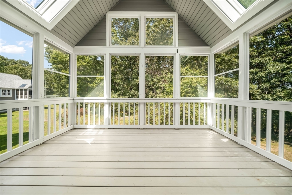 128 Audubon Drive, Unit 128 Acton, MA 01720 - Photo 9 of 42 a view of a balcony with wooden floor