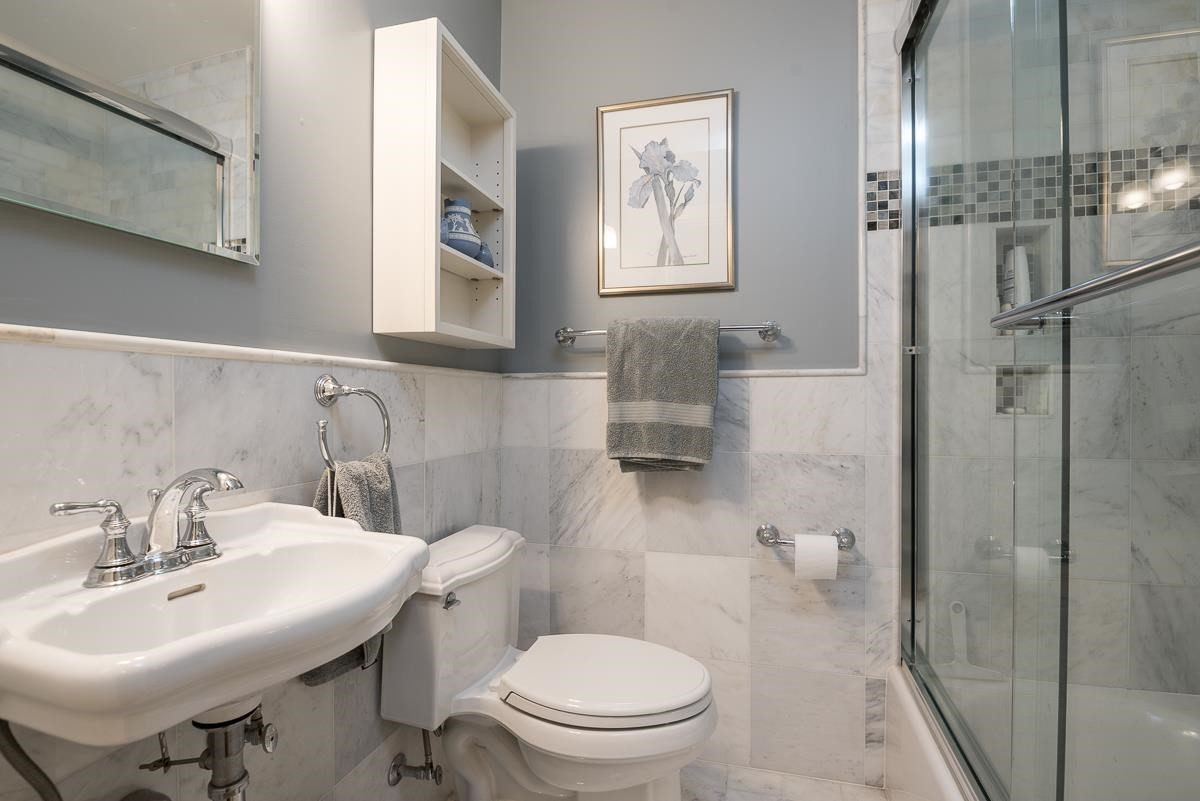 2623 Grant Avenue Raleigh, NC 27608 - Photo 16 of 25 ...has been upgraded with new fixtures and lots of Carrara marble Hall Bath