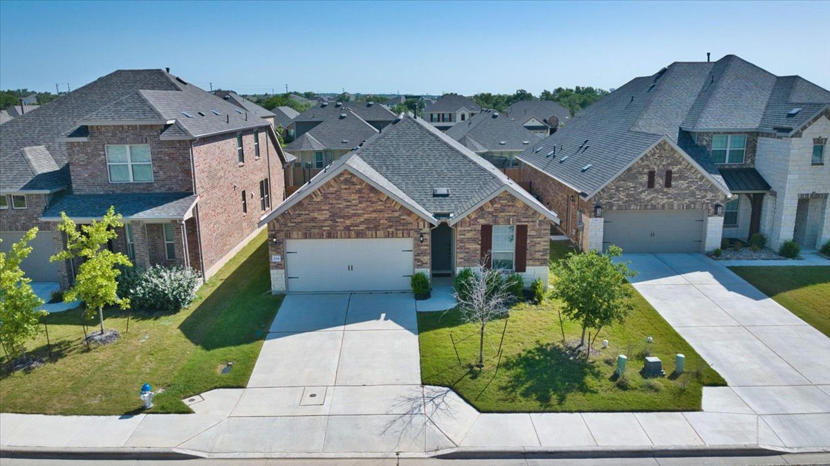 104 Raleigh Drive Georgetown, TX 78633 - Photo 1 of 37 A charming single-story residence with a neat lawn and an attached garage.