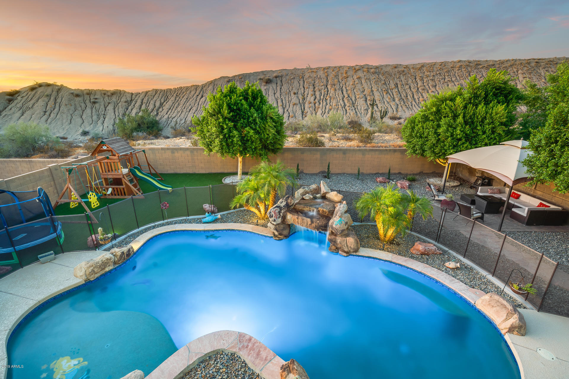 2028 West Caleb Road Phoenix, AZ 85085 - Photo 54 of 57 a view of a swimming pool with a patio