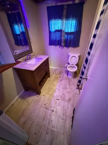 a room with furniture and wooden walls