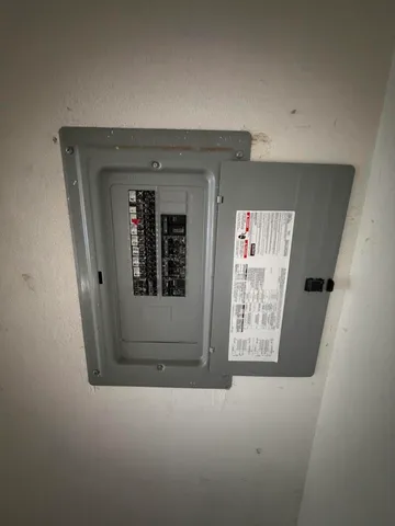 a view of a swimming pool with an outdoor seating and a forest