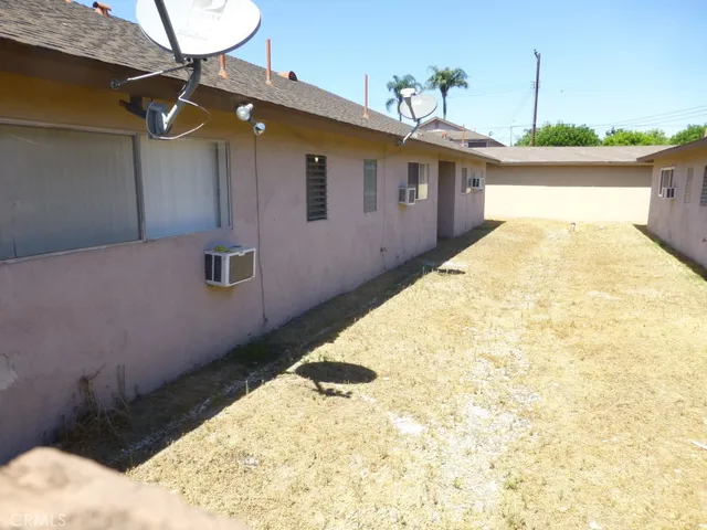a spacious bathroom with a granite countertop sink and a mirror