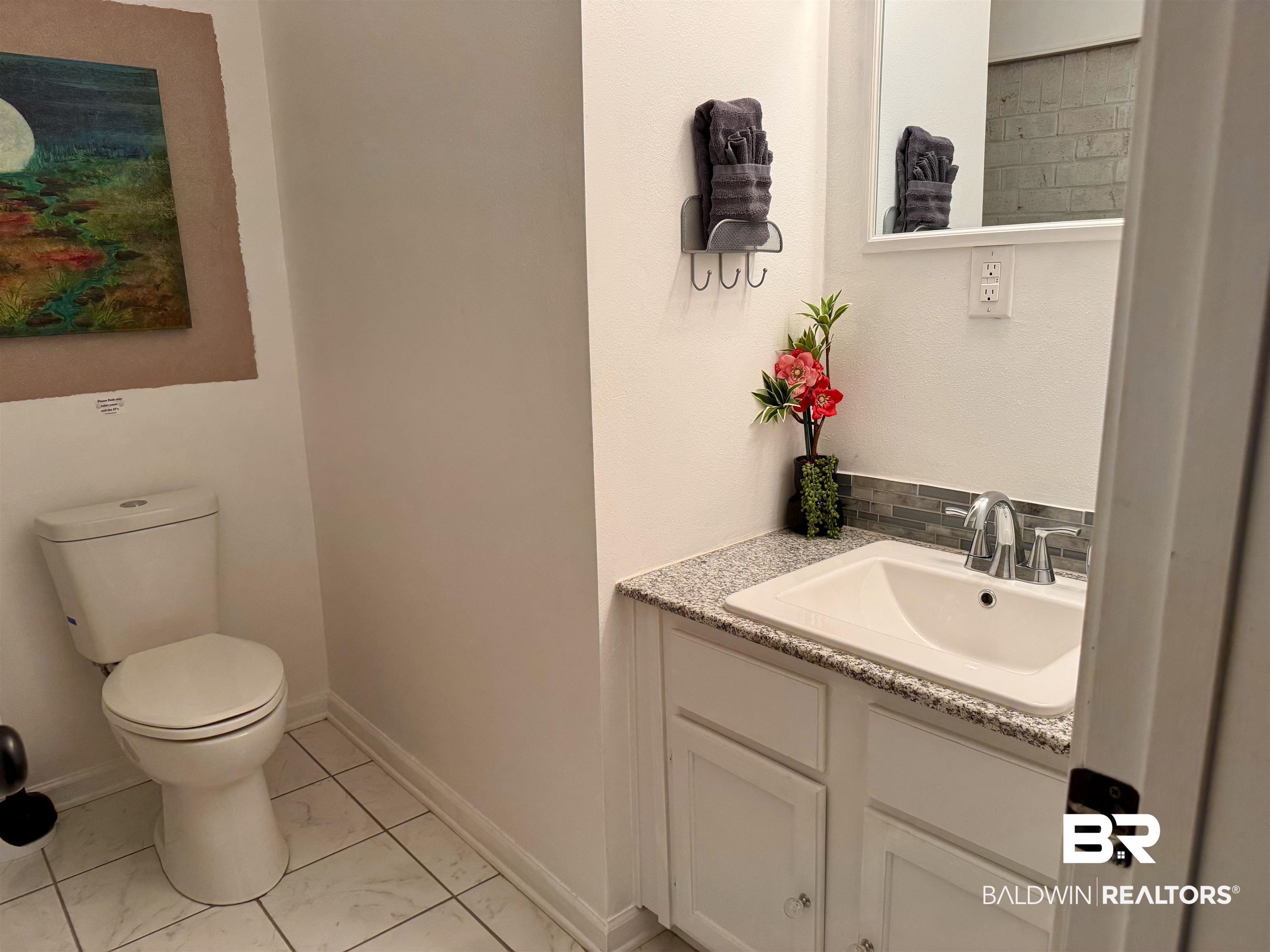 1302 Oak Street Daphne, AL 36526 - Photo 21 of 34 Bathroom with toilet and vanity