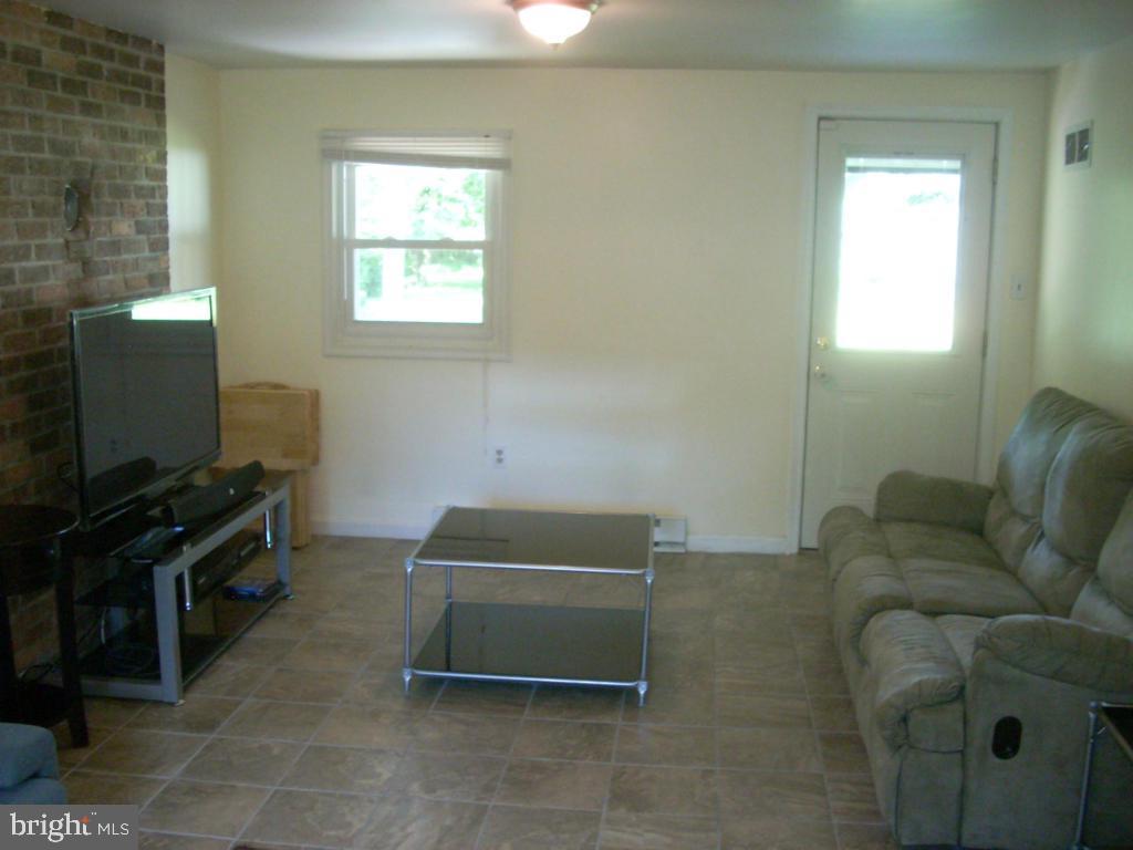 152 April Lane Lititz, PA 17543 - Photo 14 of 19 a living room with furniture and a flat screen tv