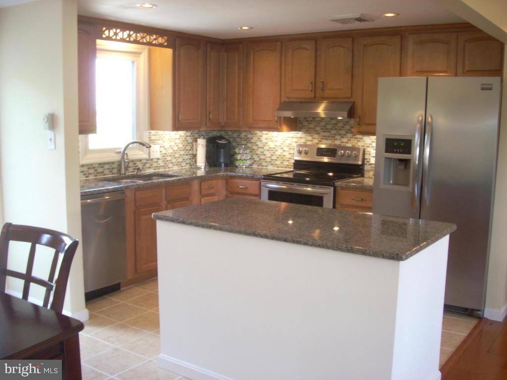 152 April Lane Lititz, PA 17543 - Photo 8 of 19 a kitchen with granite countertop a sink stainless steel appliances and cabinets