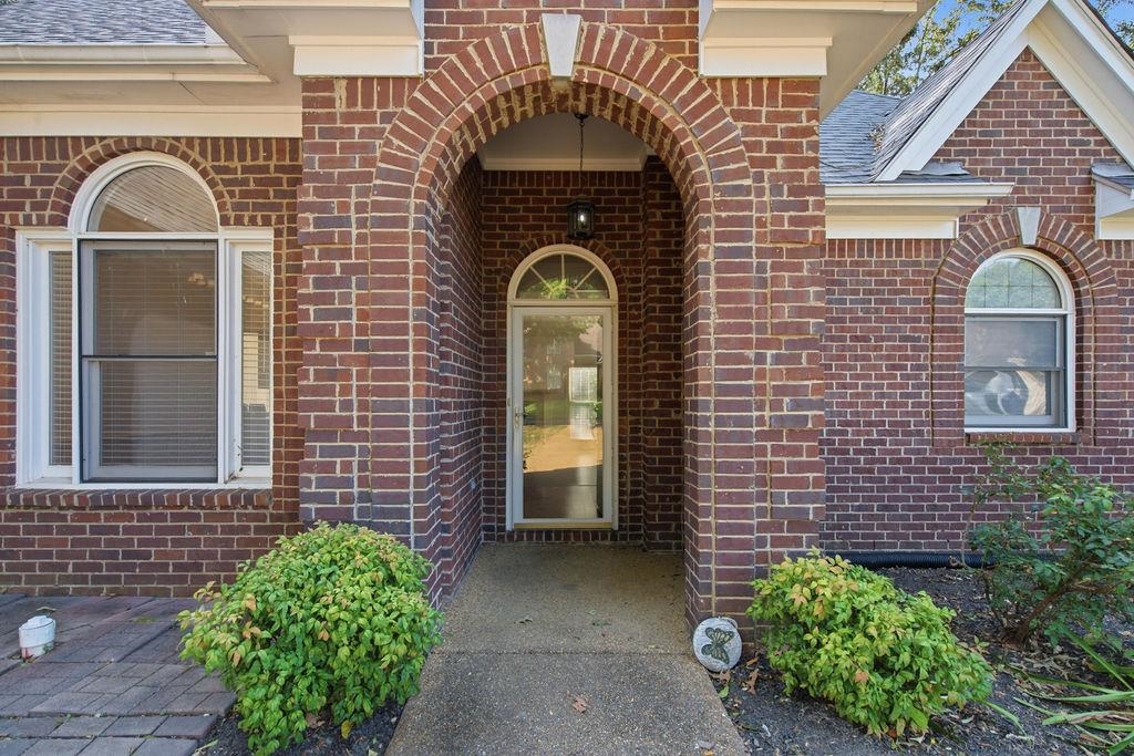 285 Great Falls Road Collierville, TN 38017 - Photo 26 of 29 Brick exterior, arched entryway, arched window, transom window, partial paved walkway