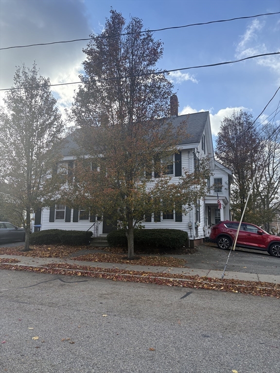 34 Walnut Street, Unit 4 Natick, MA 01760 - Photo 16 of 16 a front view of a house with a yard